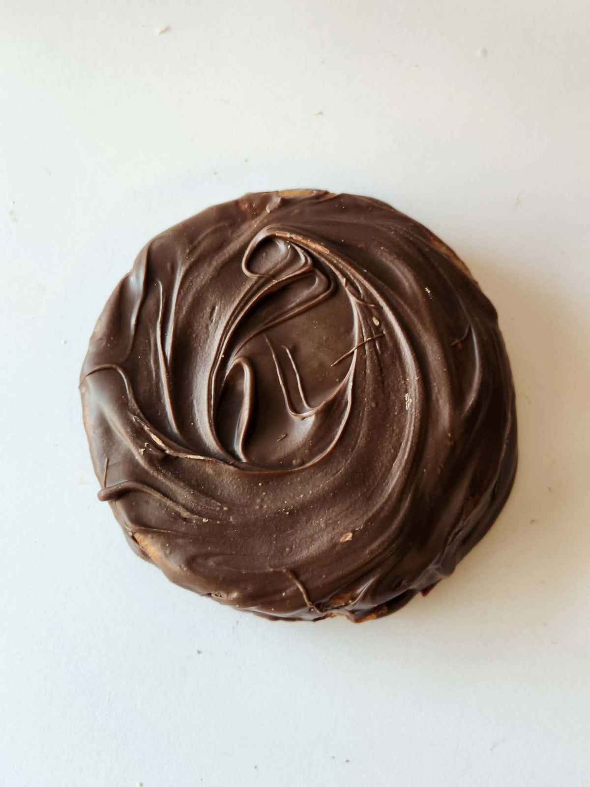 Kai's Sweet Co Raspberry Jam Roundabout top down view, milk chocolate coated with swirl finish, handmade sweet treat