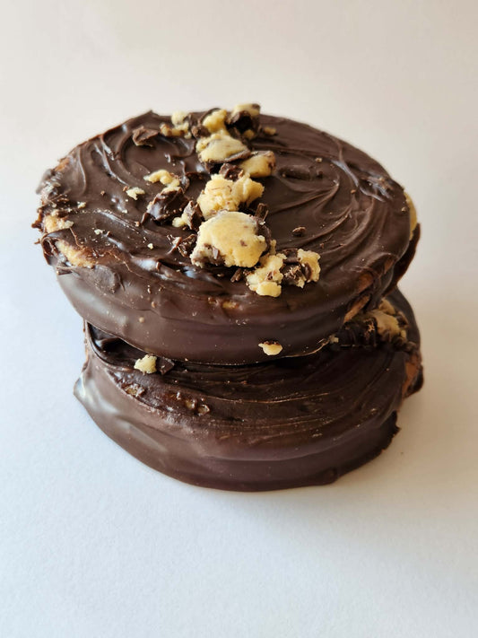 Kai's Sweet Co Cookie Dough Roundabout two stacked, chocolate coated with cookie dough crumble topping
