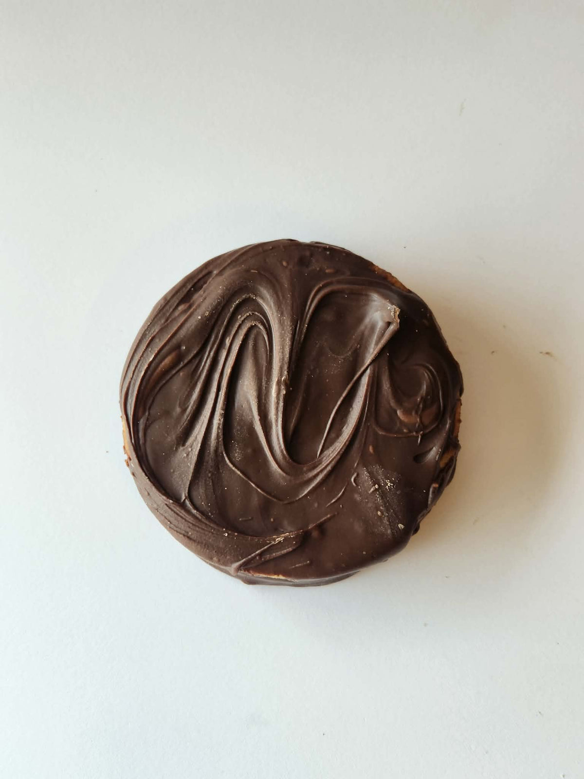 Kai's Sweet Co Nutella Roundabout top down view, milk chocolate coated with chocolate swirl finish, handmade sweet treat